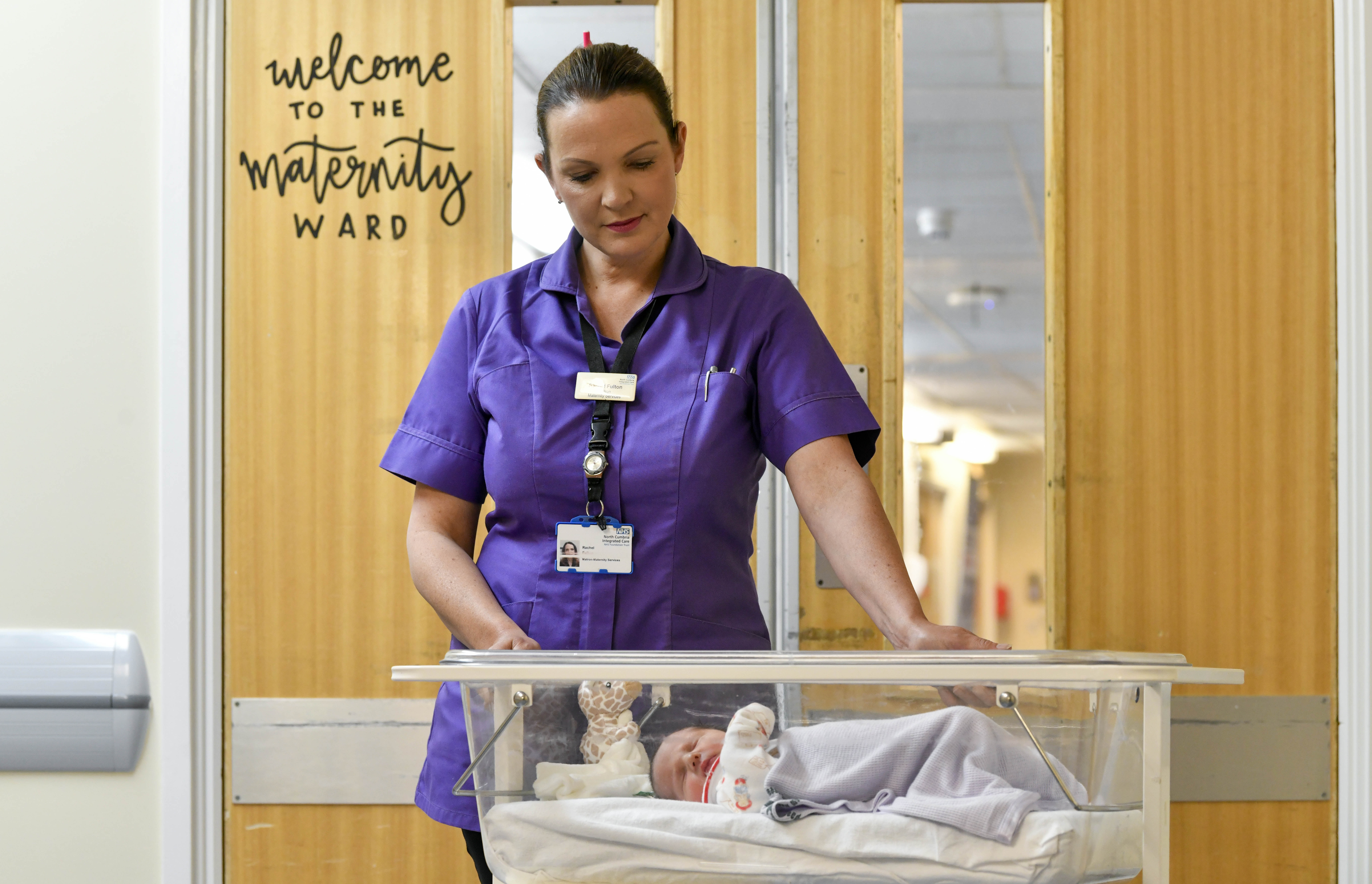 Matron Rachel Fulton looking at baby.jpg